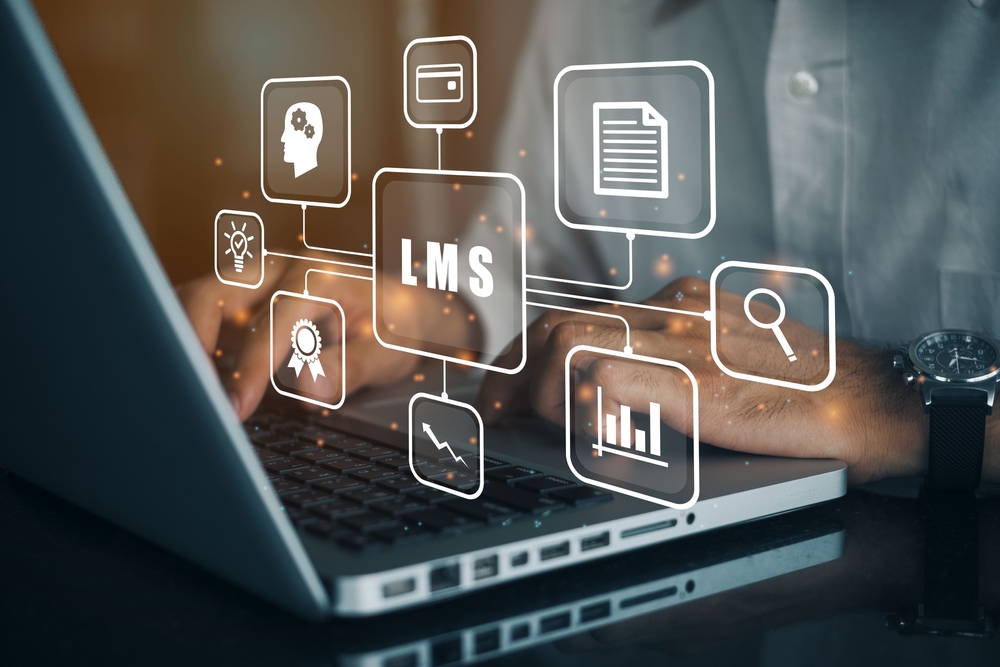 Businessman,Using,A,Computer,To,Lms, ,Learning,Management,System